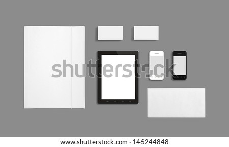 Blank Stationery Corporate ID Template isolated on grey. Consist of Business cards, Folder, Tablet PC, envelopes and smart phones.