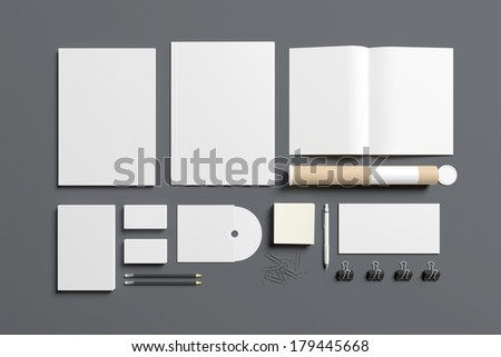 Blank stationery isolated on grey. Consist of folder, letterheads, magazine, envelope, notes, book, disk,tubus.