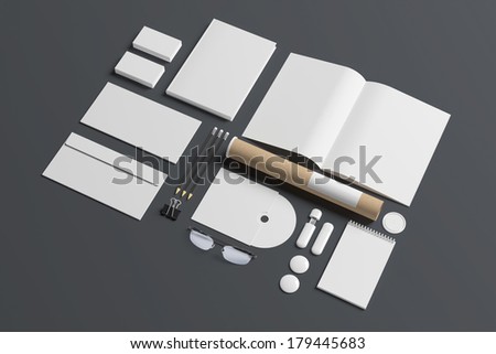 Blank stationery set isolated on grey. Consist of book, magazine, business cards, pencils, envelopes, tubus, cd disk.
