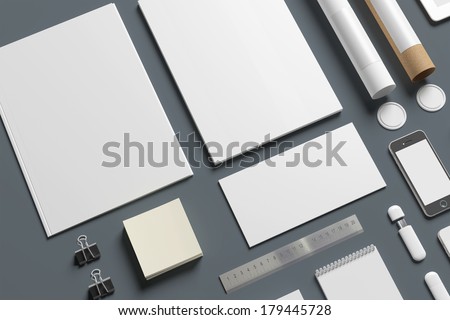 Blank stationery isolated on grey. Consist of folder, letterheads, envelope, notes, tubus.