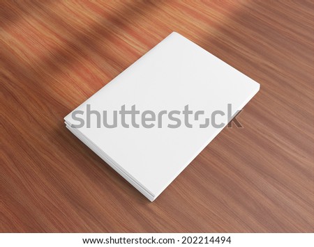 Blank closed brochures photo on wooden background to replace your design