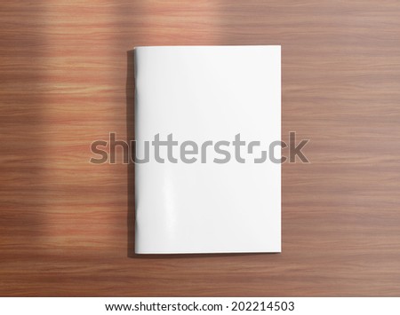 Blank closed brochure photo on wooden background to replace your design