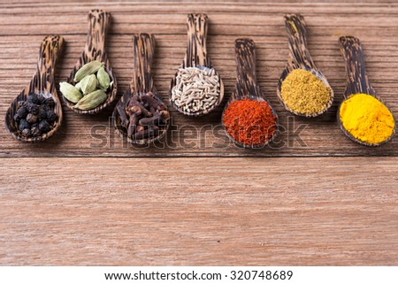 curry powder and seed herb on the wooden table