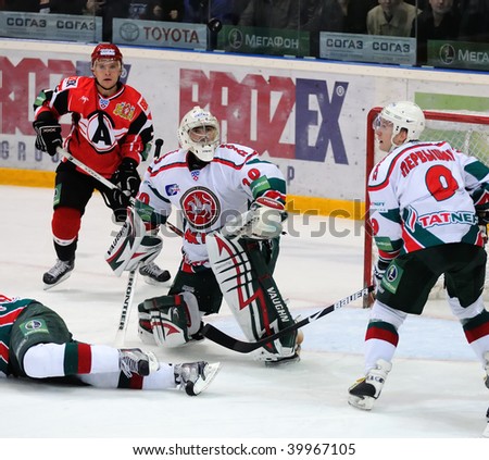 YEKATERINBURG, RUSSIA - OCT 14: Puck jumps up near the goals of S.Galimov (AK Bars) during the KHL hockey game against Automobilist held in Yekaterinburg on Oct 14 2009. AK Bars beat Automobilist 3:1