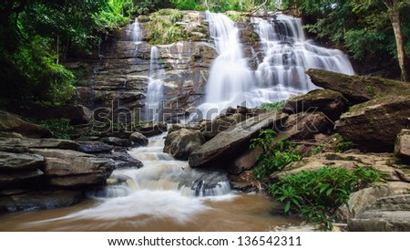 Waterfall in deep rain forest jungle. Mae Tad Waterfall, Chiang Mai, Thailand.