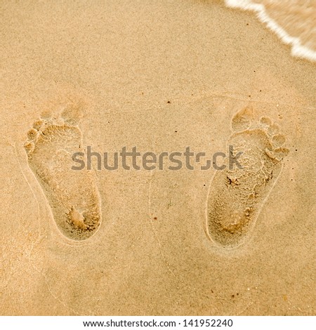 Footprints in sand on the Beach