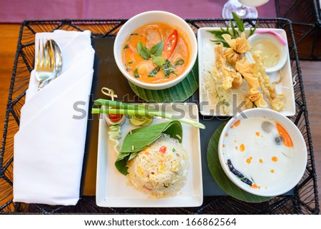 main course of Thai foods and appetizers presented beautifully with fancy garnish