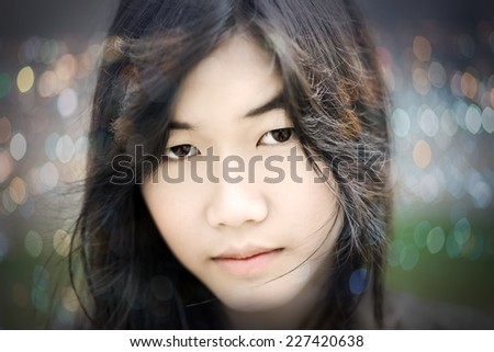close up of beautiful young asian woman face on vintage background