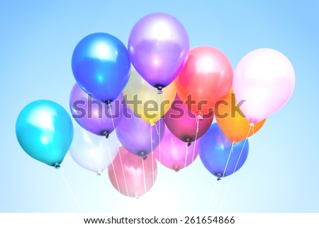 colorful balloons in blue sky and clouds