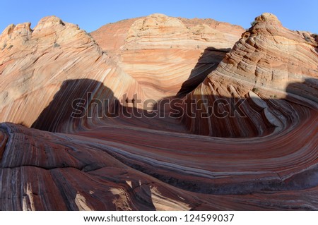 2 hikers in the morning light at Coyote Buttes North.