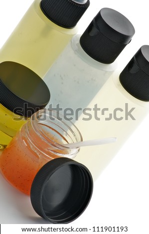 Facial Cosmetics with Apricot Scrub, Facial Cleanser, Foam, Toner and Moisturizer in Containers isolated on white background