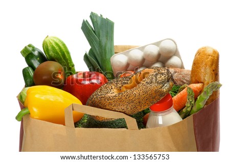 Groceries Bag with Vegetables, Bread, Greens, Fruits, Bottle of Milk and Container of Eggs isolated on white background