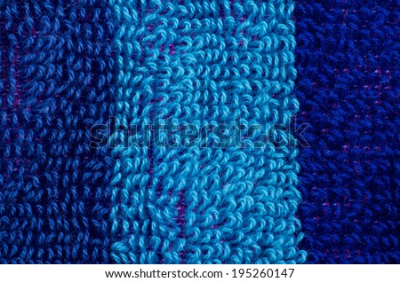 Striped Background of Navy Blue and Blue Fluffy Cotton Rows closeup