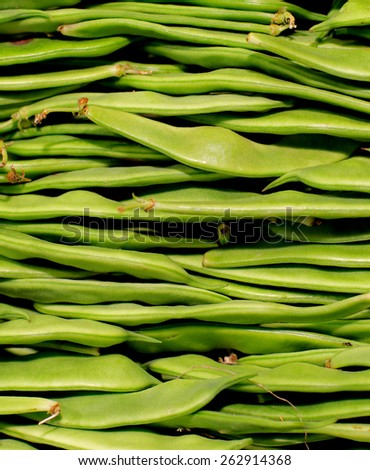 Background of Fresh Raw Stacked Green Beans with Stems closeup