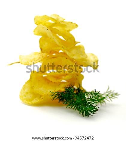 Potato Chips pyramid with dill isolated on white background