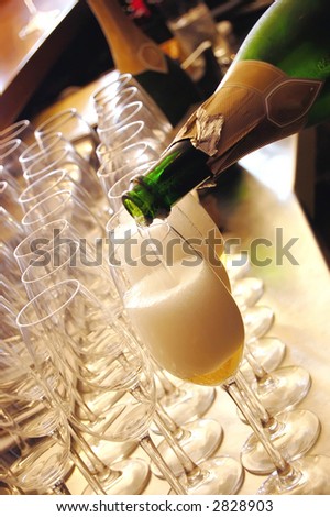stock photo champagne being poured at a wedding reception