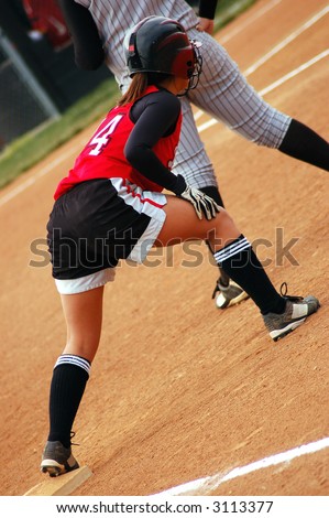 Softball player taking her lead at first base