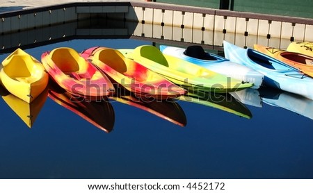 Colorful kayaks at a marina on an Oregon river
