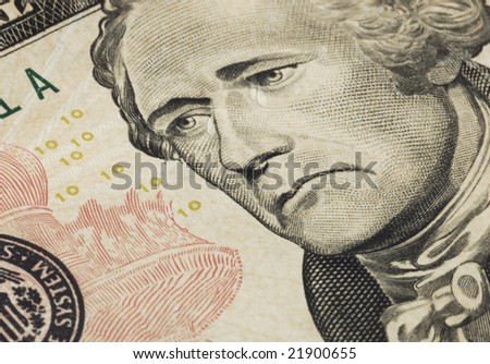 A sad president Hamilton with tears on the ten dollar bill. Represent the bad state of the economy