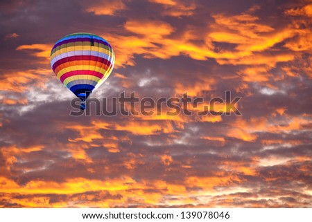 Balloon on Sunset / sunrise with clouds, light rays and other atmospheric effect