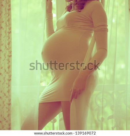 Young pregnant woman\'s belly closeup