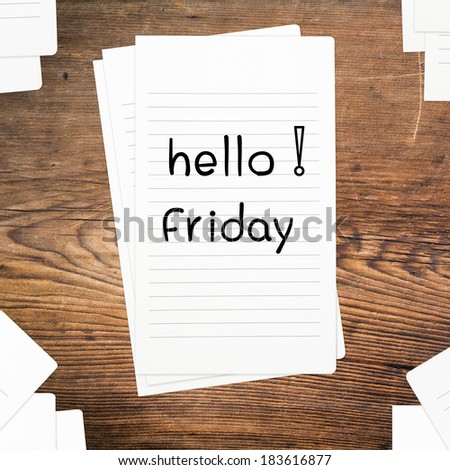 Hello Friday on paper and wood table desk