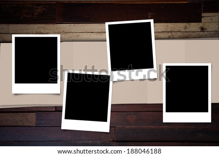 Polaroid photo frame on wood background for decoration