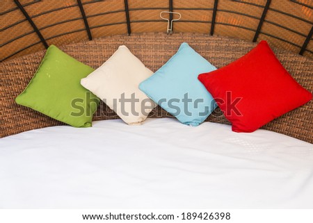 Colorful Pillow on hotel bed with space for text
