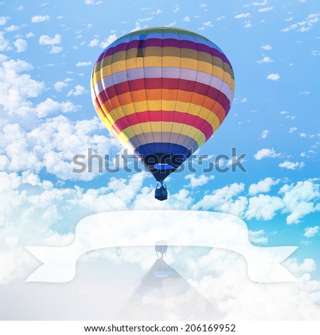 Hot air balloon on sea with cloud and blank ribbon for put text present
