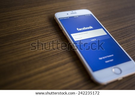CHIANG MAI THAILAND JANUARY 02 2015 Facebook Login page application on Apple iPhone 6 and wood background Facebook is largest and most popular social networking site in the world CHIANG MAI THAILAND JANUARY 02 2015 Facebook Login page application on Apple iPhone 6 and wood background Facebook is largest and most popular social networking site in the world