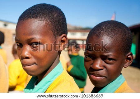 MALOLOTJA, SWAZILAND-JULY 31: Unidentified orphan schoolboys on July 31, 2008 in Malolotja Government School, Malolotja, Swaziland. Close to 10% of SwazilandÃ¢Â?Â?s population are orphans, due to HIV/AIDS.