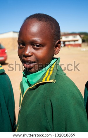 MALOLOTJA, SWAZILAND-JULY 31: Unidentified orphan schoolboy on July 31, 2008 in Malolotja Government School, Malolotja, Swaziland. Close to 10% of SwazilandÃ¢Â?Â?s population are orphans, due to HIV/AIDS.