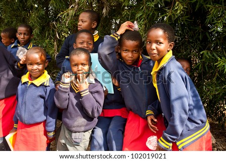 PIGGS PEAK, SWAZILAND-JULY 29: Unidentified Swazi pupils on July 29, 2008 in Nazarene Mission School, Piggs Peak, Swaziland. Close to 10% of SwazilandÃ¢Â?Â?s population are orphans, due to HIV/AIDS.