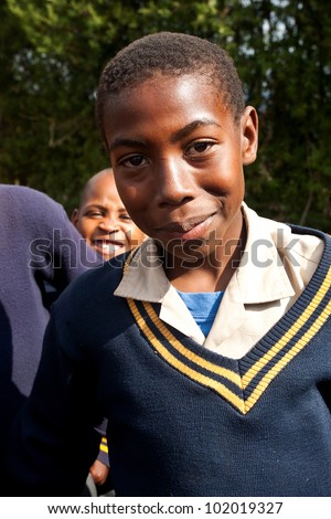 PIGGS PEAK, SWAZILAND-JULY 29: Unidentified Swazi schoolboys on July 29, 2008 in Nazarene Mission School, Piggs Peak, Swaziland. Close to 10% of SwazilandÃ¢Â?Â?s population are orphans, due to HIV/AIDS.