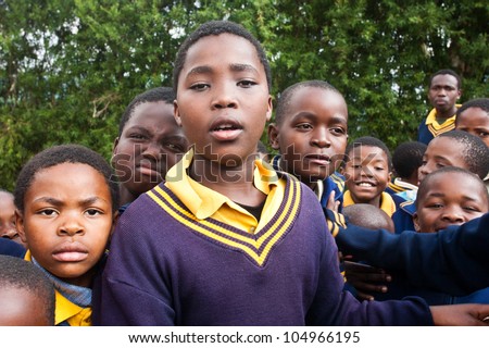 PIGGS PEAK, SWAZILAND-JULY 29: Unidentified orphan Swazi schoolboys on July 29, 2008 in Nazarene School, Piggs Peak, Swaziland. Close to 10% of Swazilands population are orphans, due to HIV/AIDS.