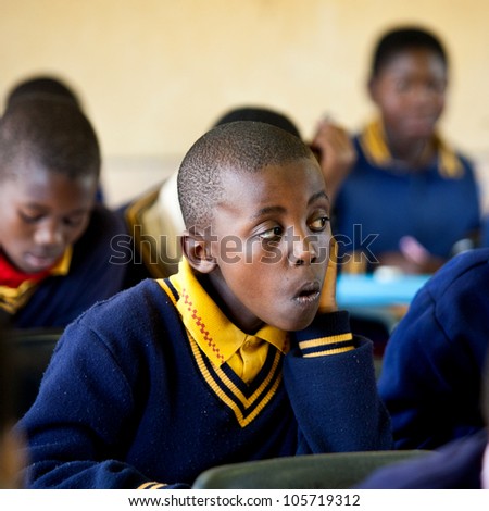 PIGGS PEAK, SWAZILAND-JULY 29: Unidentified orphan student on July 29, 2008 in Nazarene Mission School, Piggs Peak, Swaziland. Close to 10% of Swazilands population are orphans, due to HIV/AIDS.
