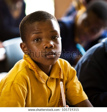 PIGGS PEAK, SWAZILAND-JULY 29: Unidentified orphan student on July 29, 2008 in Nazarene Mission School, Piggs Peak, Swaziland. Close to 10% of Swazilands population are orphans, due to HIV/AIDS.