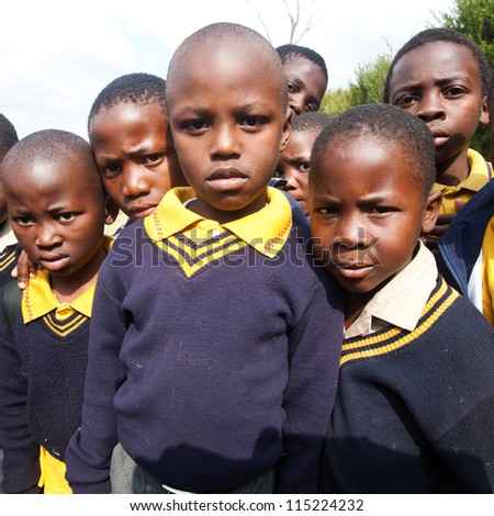 PIGGS PEAK, SWAZILAND-JULY 29: Unidentified orphan schoolboys on July 29, 2008 in Nazarene Mission School, Piggs Peak, Swaziland. Close to 10% of Swaziland\'s population are orphans, due to HIV/AIDS.