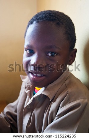 PIGGS PEAK, SWAZILAND-JULY 29: Unidentified orphan schoolboy on July 29, 2008 in Nazarene Mission School, Piggs Peak, Swaziland. Close to 10% of Swaziland's population are orphans, due to HIV/AIDS.