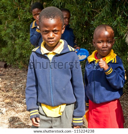 PIGGS PEAK, SWAZILAND-JULY 29: Unidentified orphan children on July 29, 2008 in Nazarene Mission School, Piggs Peak, Swaziland. Close to 10% of Swaziland\'Â?Â?s population are orphans, due to HIV/AIDS.