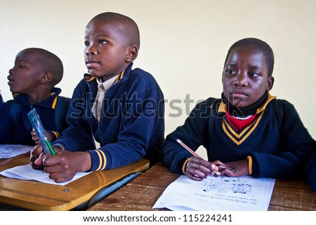 PIGGS PEAK, SWAZILAND-JULY 29: Unidentified orphan children on July 29, 2008 in Nazarene Mission School, Piggs Peak, Swaziland. Close to 10% of Swaziland'Â?Â?s population are orphans, due to HIV/AIDS.