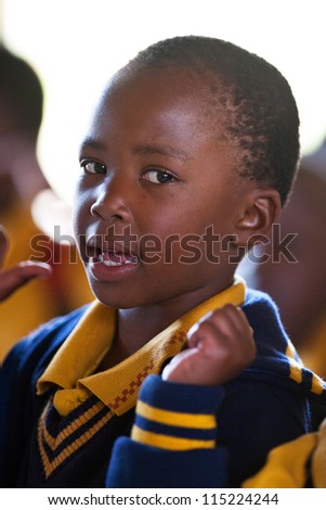 PIGGS PEAK, SWAZILAND-JULY 29: Unidentified orphan schoolboy on July 29, 2008 in Nazarene Mission School, Piggs Peak, Swaziland. Close to 10% of Swaziland\'Â?Â?s population are orphans, due to HIV/AIDS.