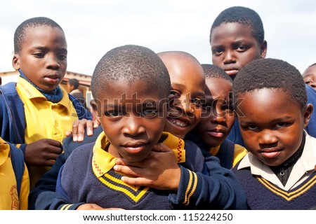 PIGGS PEAK, SWAZILAND-JULY 29: Unidentified orphan schoolboys on July 29, 2008 in Nazarene Mission School, Piggs Peak, Swaziland. Close to 10% of Swaziland\'Â?Â?s population are orphans, due to HIV/AIDS.