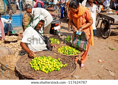 VARANASI - APRIL 23: Market vendors selling vegetables on a market on April 23, 2011 in Varanasi, India. India ranks second worldwide in farm output. Agriculture employs 52.1% of the total workforce.