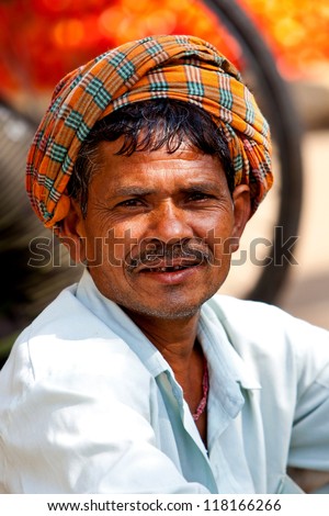 VARANASI - APR 23: Portrait of a market vendor working on a market on April 23, 2011 in Varanasi, India. India ranks second worldwide in farm output. Agriculture employs 52.1% of the total workforce