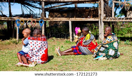MAASAI MARA, KENYA - OCT 15: Unidentified Maasai people on Oct 15, 2012 in Maasai Mara, Kenya. Maasai are a Nilotic ethnic group of semi-nomadic people in Kenya and northern Tanzania.