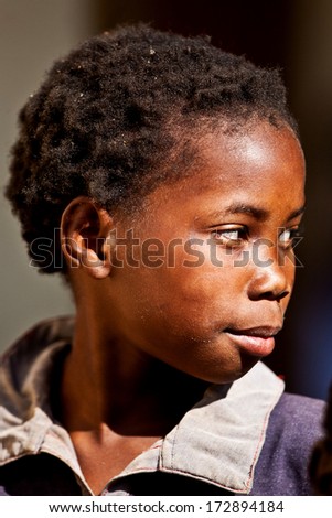MBABANE, SWAZILAND - AUGUST 5: Portrait of unidentified orphan Swazi boy on August 5, 2008 in Mbabane, Swaziland. Close to 10 percent of Swaziland\'s total population are orphans, due to HIV/AIDS.