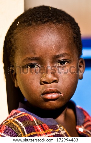 MBABANE, SWAZILAND - AUGUST 5: Portrait of an unidentified orphan Swazi boy on August 5, 2008 in Mbabane, Swaziland. Close to 10 percent of Swaziland\'s total population are orphans, due to HIV/AIDS.