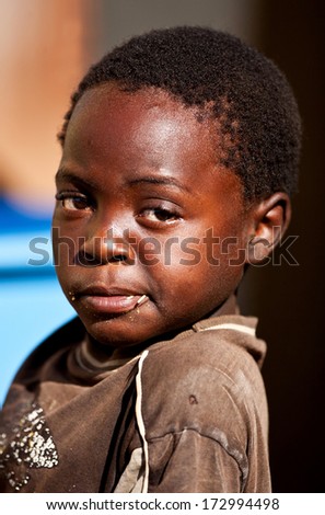MBABANE, SWAZILAND - AUGUST 5: Portrait of an unidentified orphan Swazi boy on August 5, 2008 in Mbabane, Swaziland. Close to 10 percent of Swaziland\'s total population are orphans, due to HIV/AIDS.