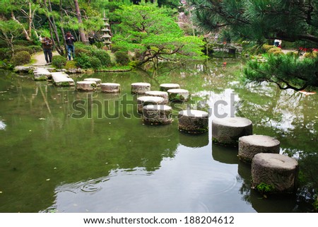 KYOTO, JAPAN - March 27, 2014: A stone path in the Zen Garden of the Heian-jingu Shrine on March 27, 2014 in Kyoto, Japan. Heian-jingu Shrine is listed as an important cultural property of Japan.